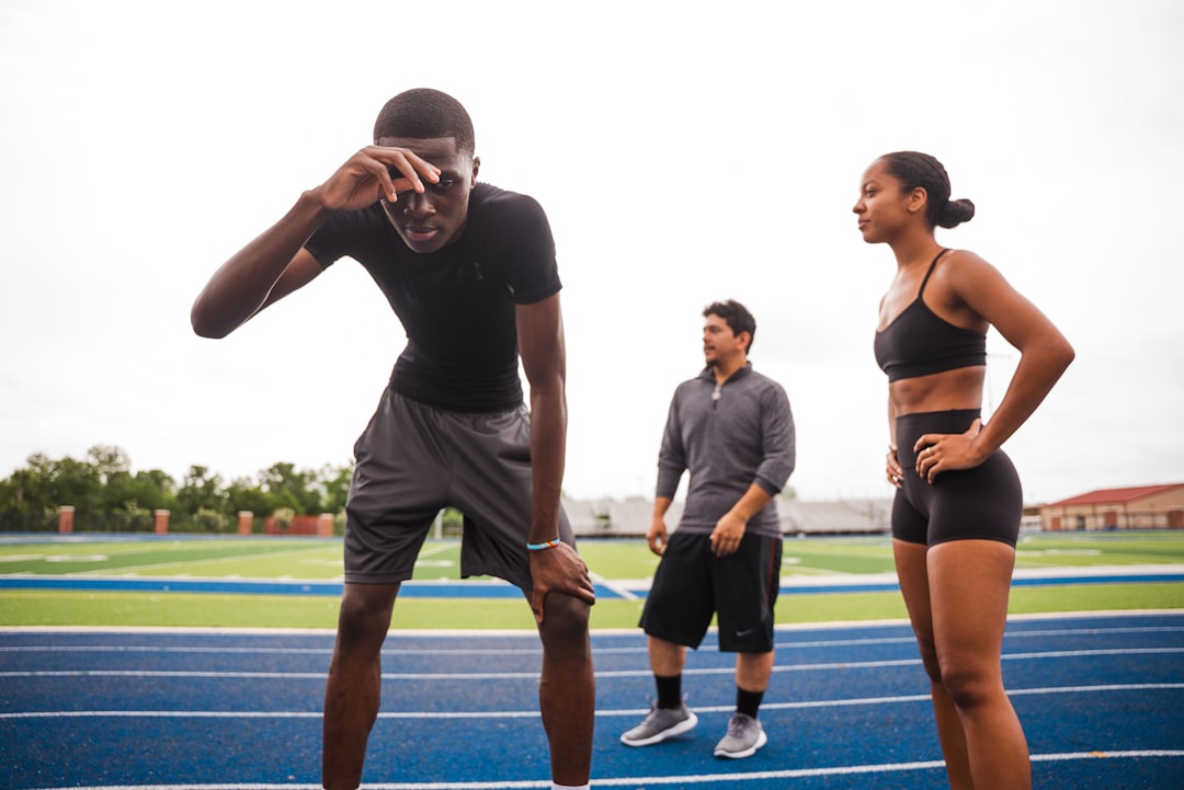 athletes-resting-on-a-track-after-training-d43jyb0ytku